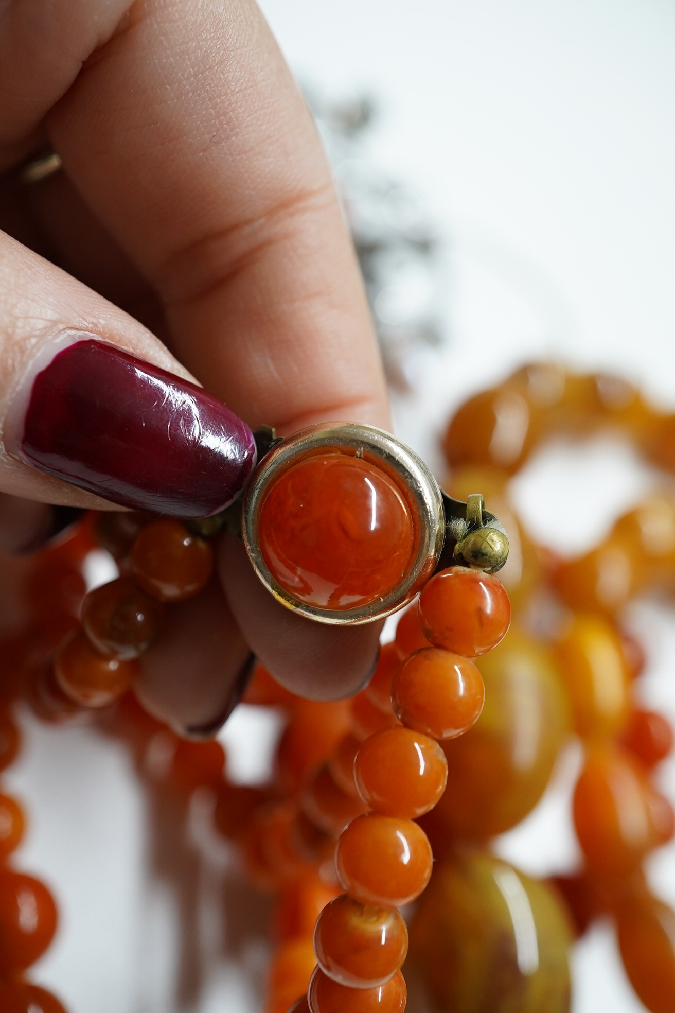 A French 1920's/1930's base metal and bakelite? set bracelet by Jacob Bengal?,18cm, together with an 18ct and gem set ring, a 9ct heart locket and a quantity of assorted costume jewellery. Condition - poor to fair